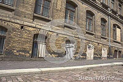 Street with residential building in need of renovation Stock Photo